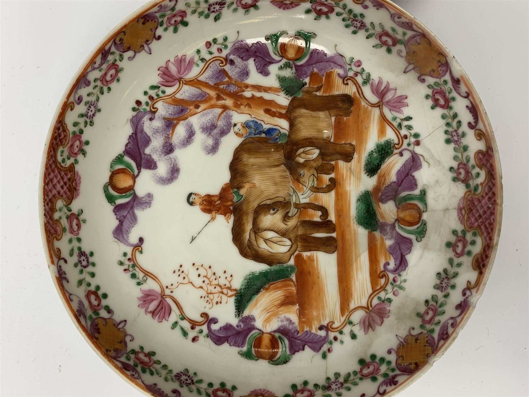 18th Century Chinese export tea bowl and saucer, decorated in the Famille Rose pallet with figures and elephants, tea bowl D8.5cm, saucer D13.5cm