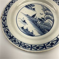 An 18th century Delft tin glazed plate, painted with waterside landscape, D24cm