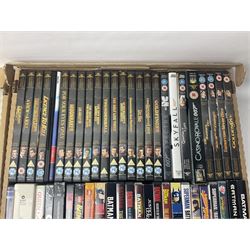 Large collection of VHS tapes, DVDS, CDs to include Queen, James Bond 007, Batman etc, in three boxes
