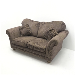 Two seat sofa upholstered in aubergine embossed fabric, turned supports, W190cm