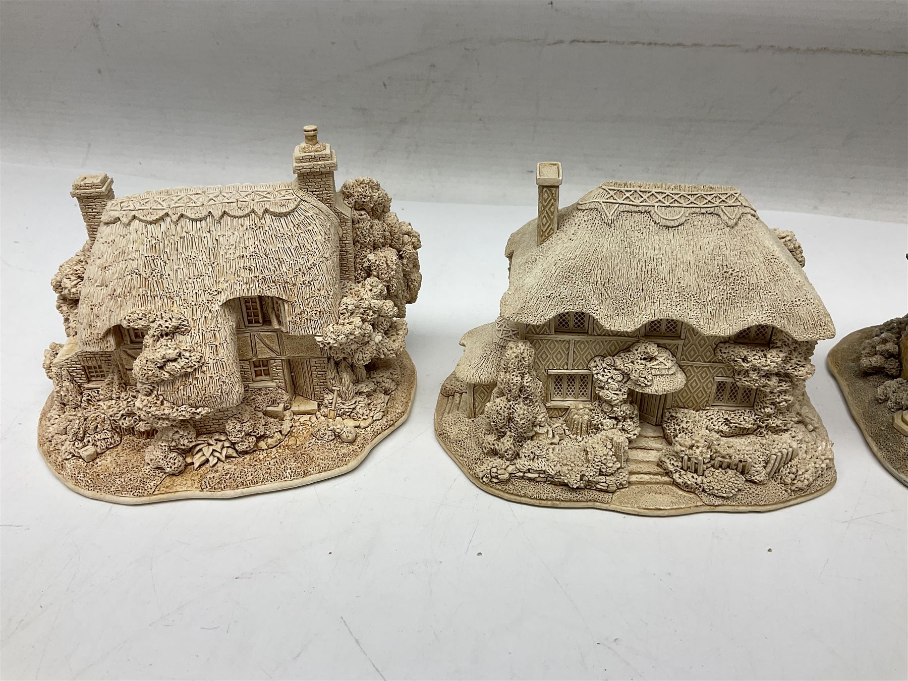 Twenty-three Lilliput Lane models from the Paint Your Own collection, to include Catmint Cottage, Sugar and Spice, Gypsy Cottage, Ruby Cottage and Little Birch, some boxed