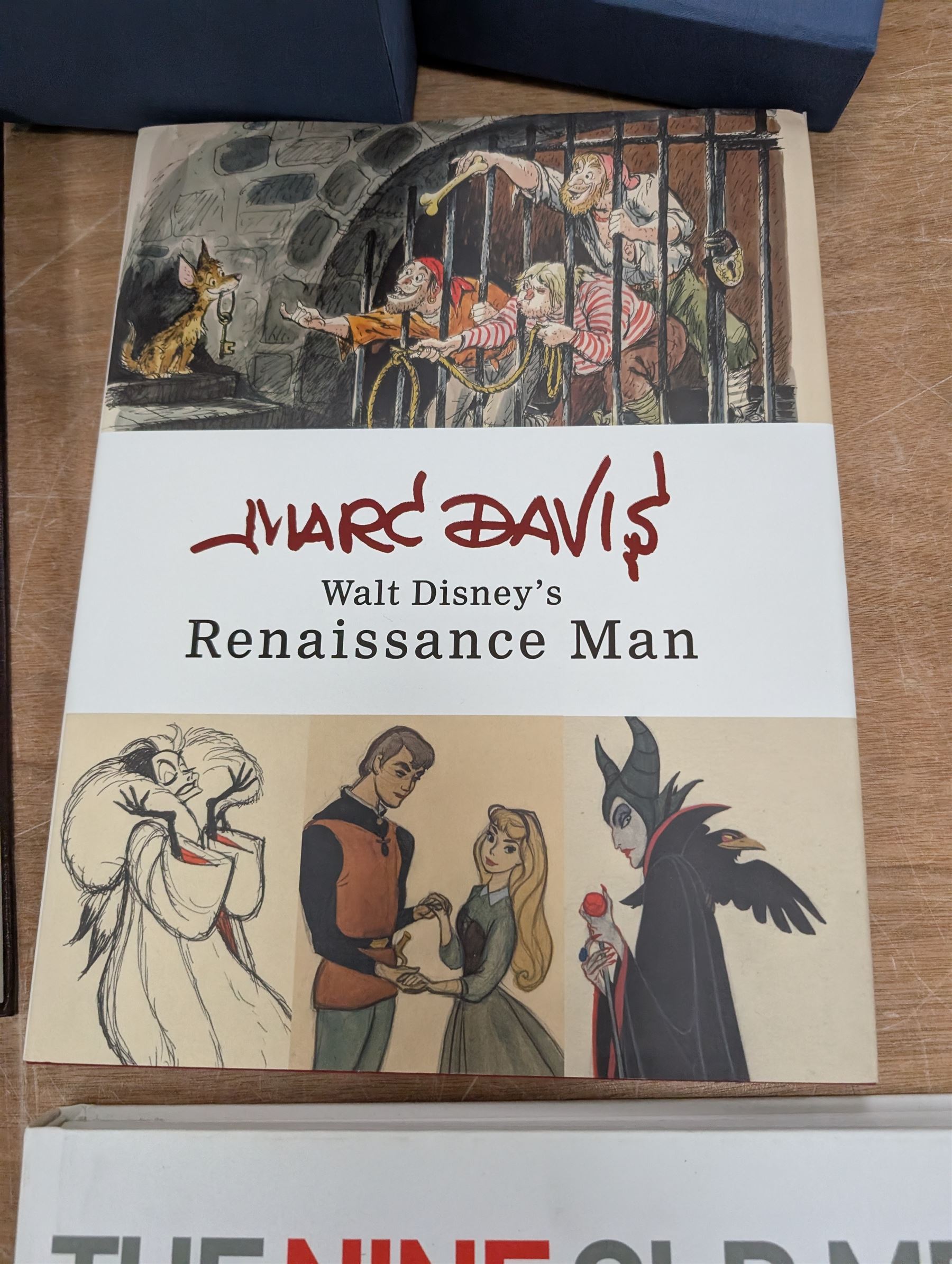 Collection of Disney animation and drawing books, including Walt Disney's Nine Old Men flipbooks, three Nine Old Men reference books, Marc Davis Walt Disney's Renaissance Man, A Disney Sketchbook and The Illusion of Life (7)