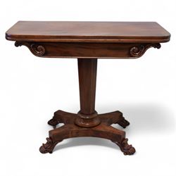 Victorian mahogany tea table, rectangular swivel fold-over top, tapering octagonal column on shaped platform, C-scroll and foliate carved feet with brass castors 