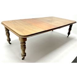 19th century mahogany telescopic extending dining table, moulded top, turned supports on brass castors 