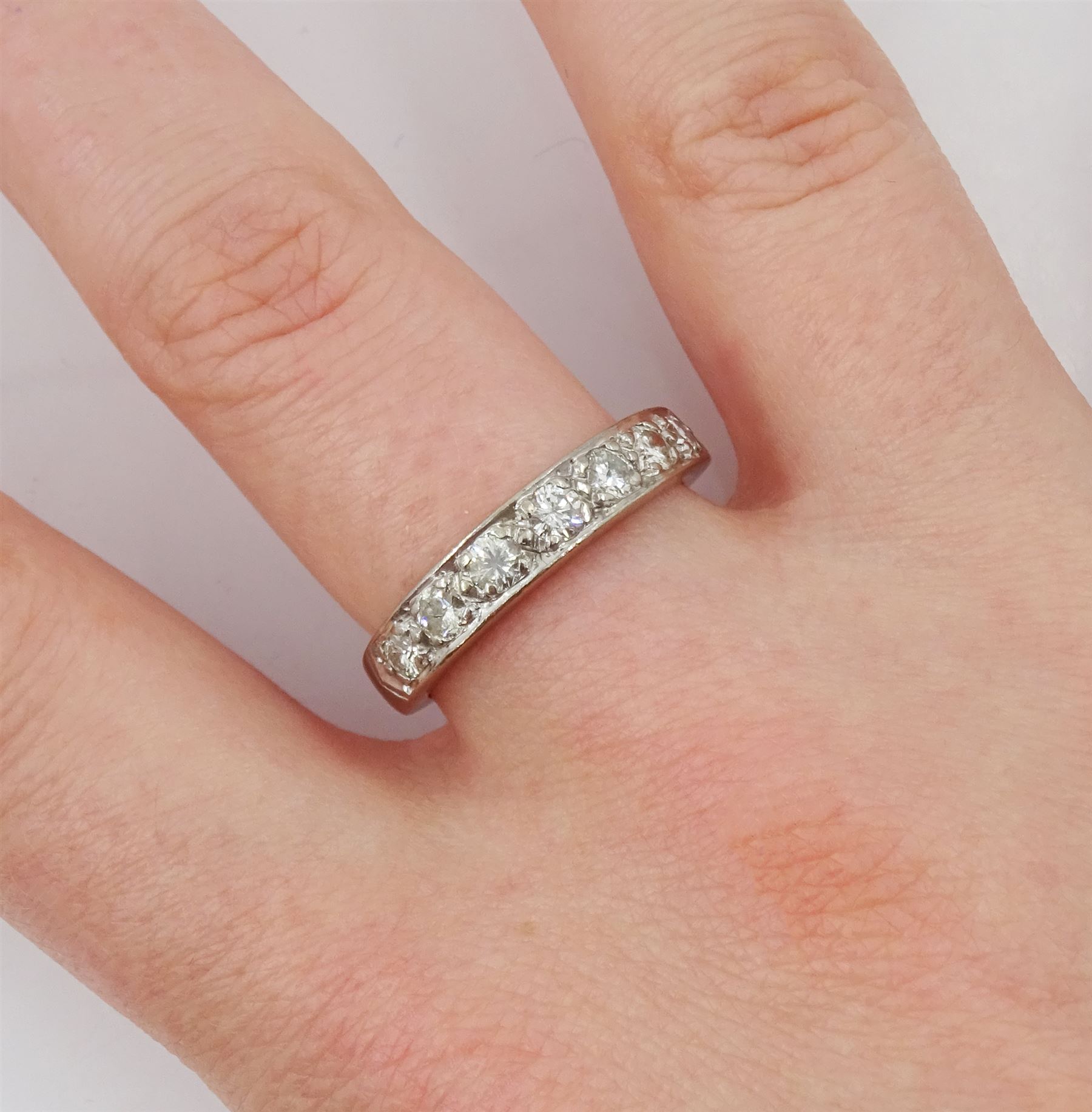 18ct white gold seven stone round brilliant cut diamond half eternity ring, London 1977, total diamond weight approx 0.50 carat
