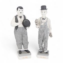Pair of Spanish Algora Personajes Del Cine figures, modelled as Stan Laurel and Oliver Hardy, with printed marks beneath, both with certificates of authenticity, H37cm