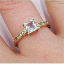 9ct gold princess cut blue topaz ring with diamond set shoulders, hallmarked