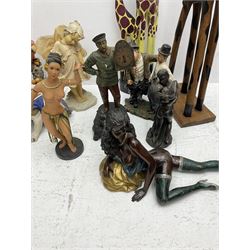 Quantity of figures to include composite and hardwood examples, to include lamp modelled  with dolphins, Laurel and Hardy figure, giraffes etc