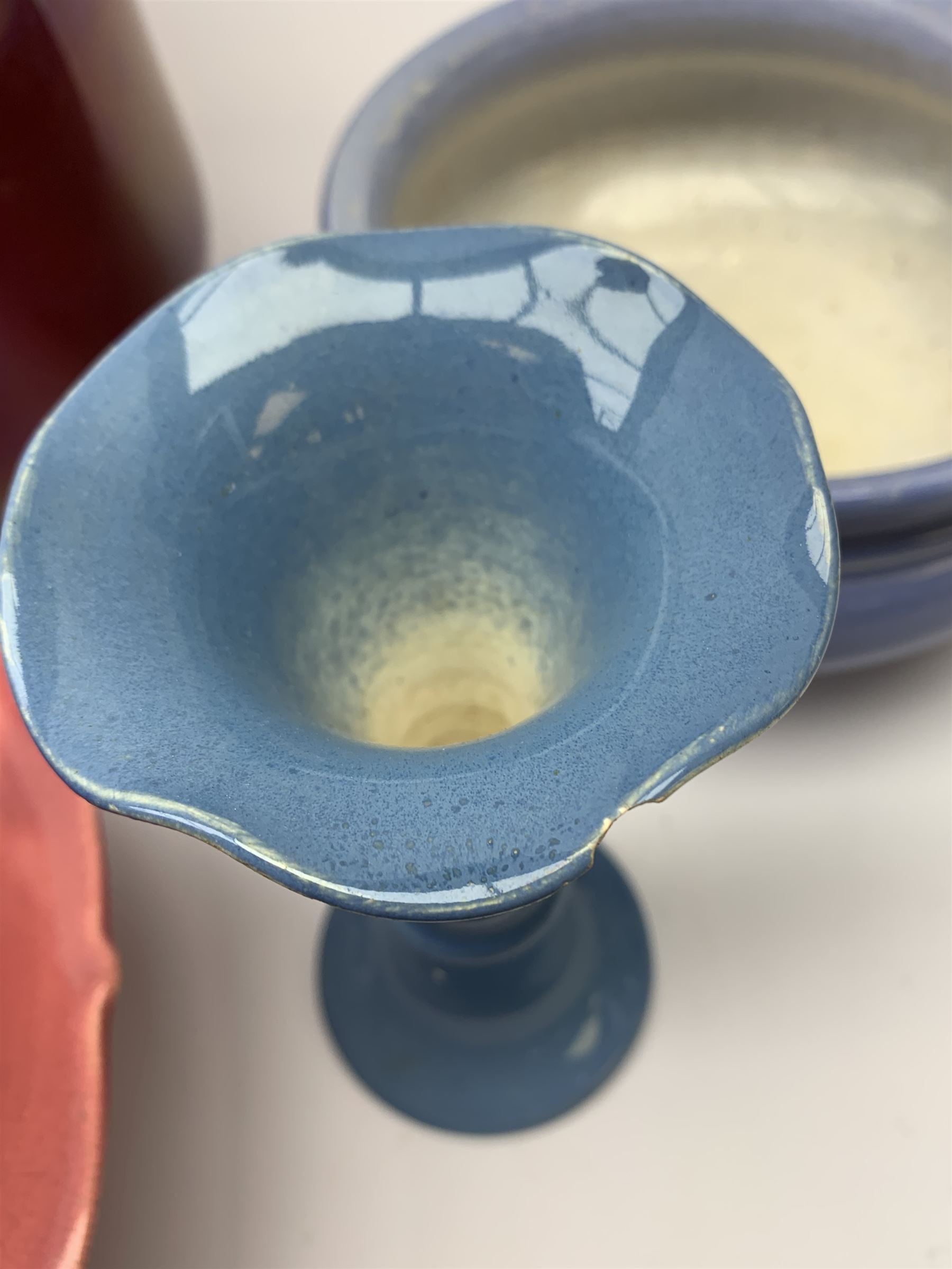 Two Bretby jardinières, hexagonal planter and trumpet shaped vase,  preserve pot and chamberstick together with an Ault pink glazed candlestick and low comport (8)