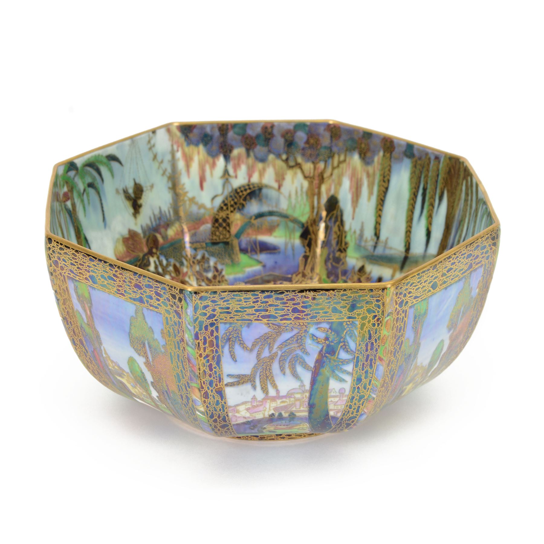 Early 20th century Wedgwood Fairland lustre bowl, circa 1920, of octagonal form, designed by Daisy Makeig-Jones, the exterior decorated in the Castle on the Road pattern, the interior decorated in the Fairy in a Cage pattern, pattern no Z5125, with printed marks beneath, H11cm D22.5cm
