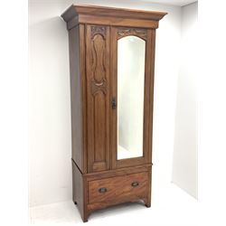 *Edwardian walnut narrow single wardrobe, projecting cornice over single bevelled mirror glazed door, panelled front carved with shells and flower heads, base fitted with single drawer, W90cm, H202cm, D54cm