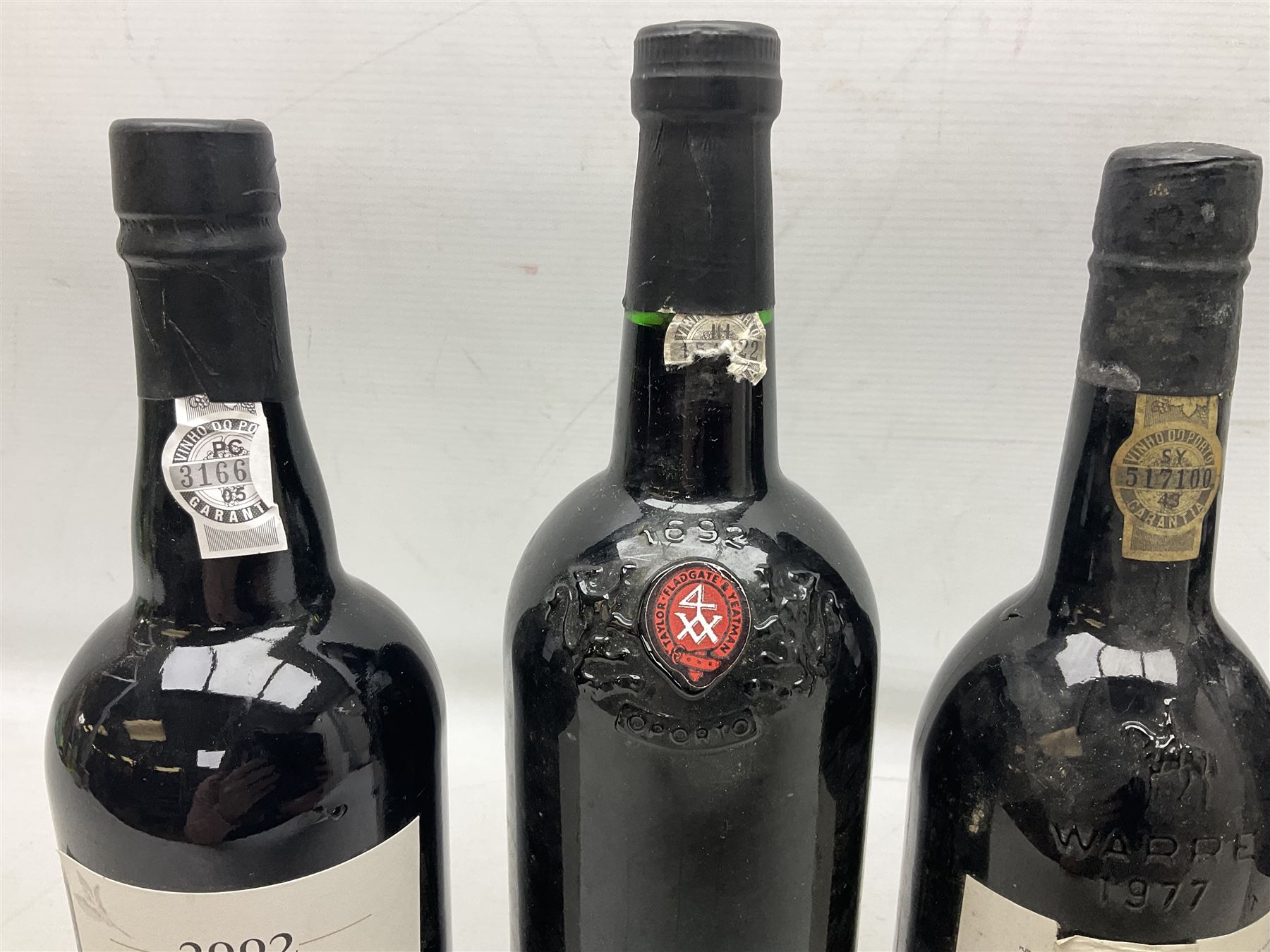 Mixed port, comprising Warre's 1977, vintage port, Quinta do Estanho, 1997, vintage port, Croft Quinta da Roeda, 2002, vintage port, Taylors, 1994, port and Taylors 2015, port, various contents and proof (5)