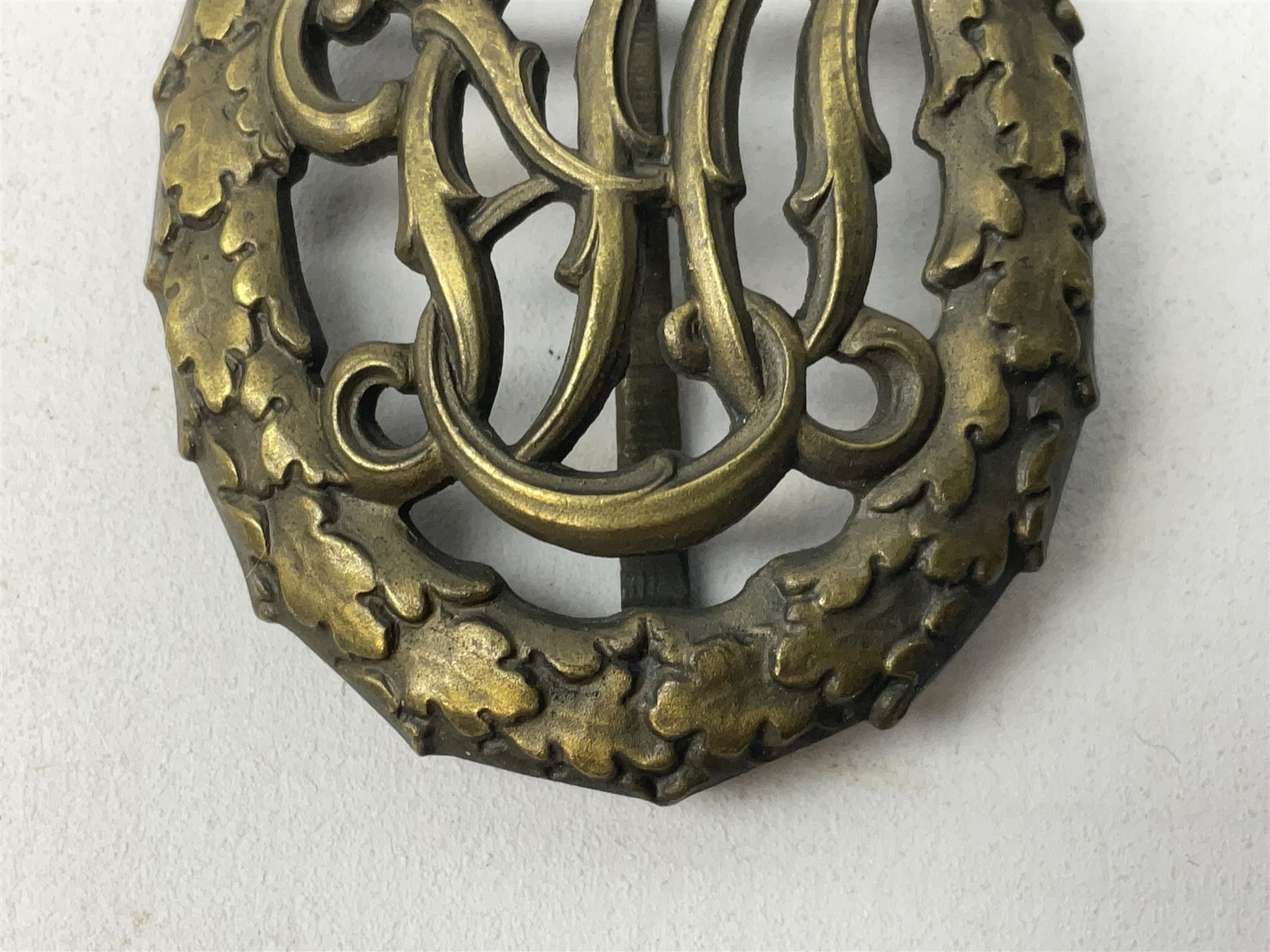 Two WW2 German Sports badges - SA sports badge marked verso 'W.Redo Eigentum D. Obersten SA. Fuhrung Saar Lautern'; and DRL sports badge marked verso 'Wernstein Jena D.R.G.M. 35269' (2)