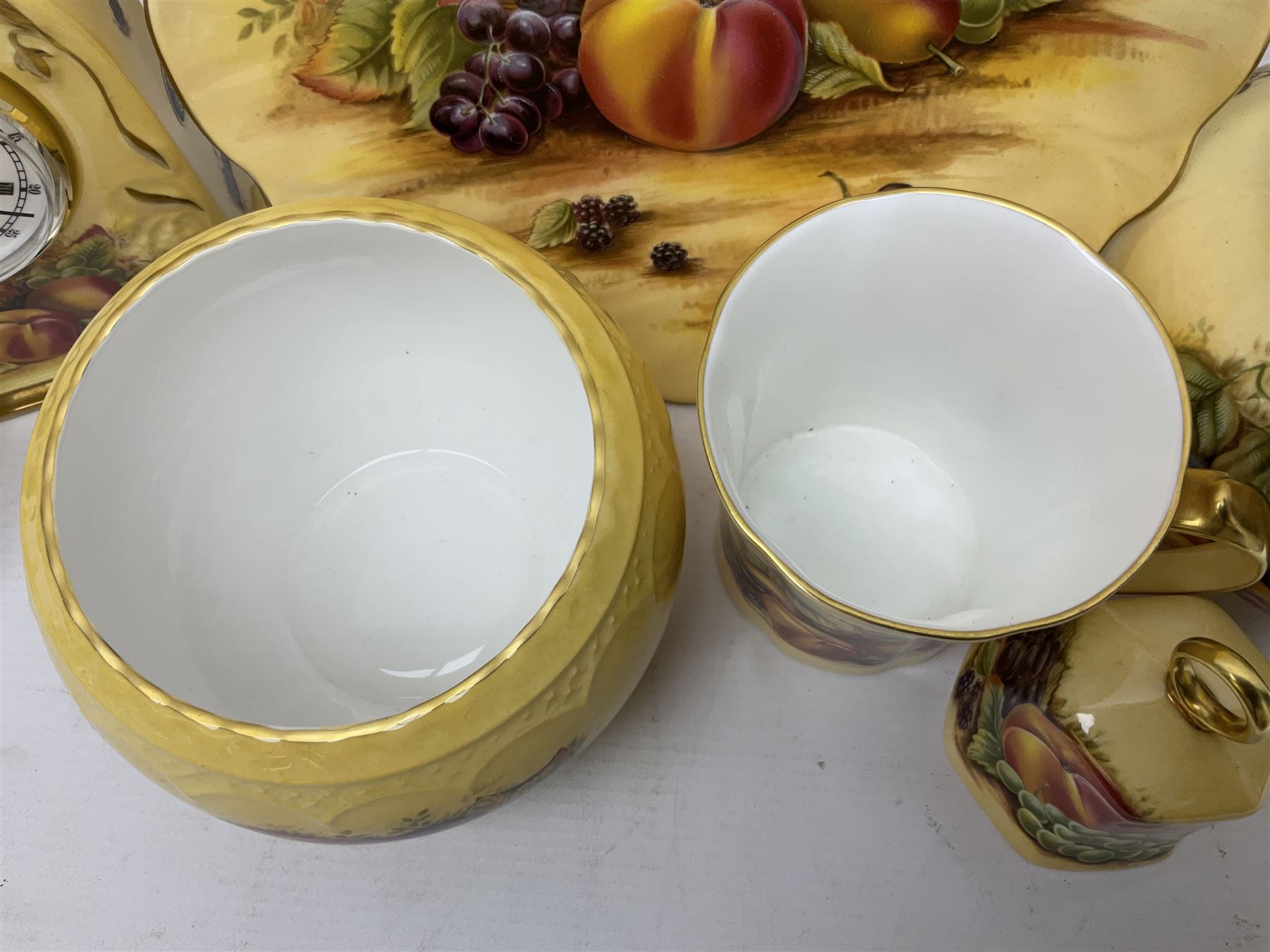 Aynsley Orchard Gold five coffee cans and saucers, mantel clock, plate etc 