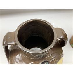 T. Forester Phoenix ware ewer of tapering form decorated with peacock and Bretby twin handled vase decorated with figures fishing in a boat sea scene