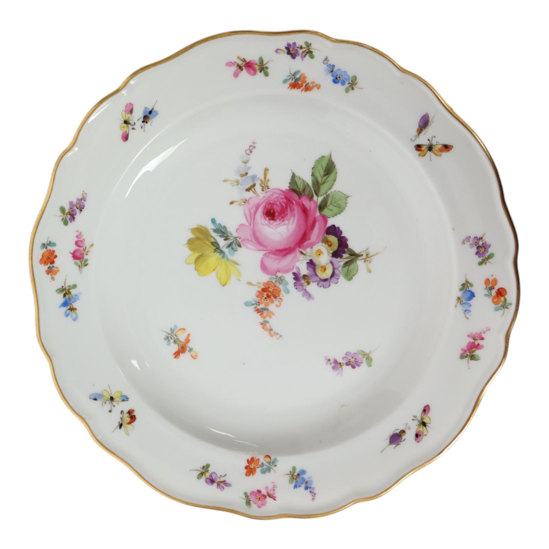 Four early 20th Century Meissen plates, hand painted with floral sprays, sprigs and inspects, with underglaze blue cross sword mark beneath, D21.5cm