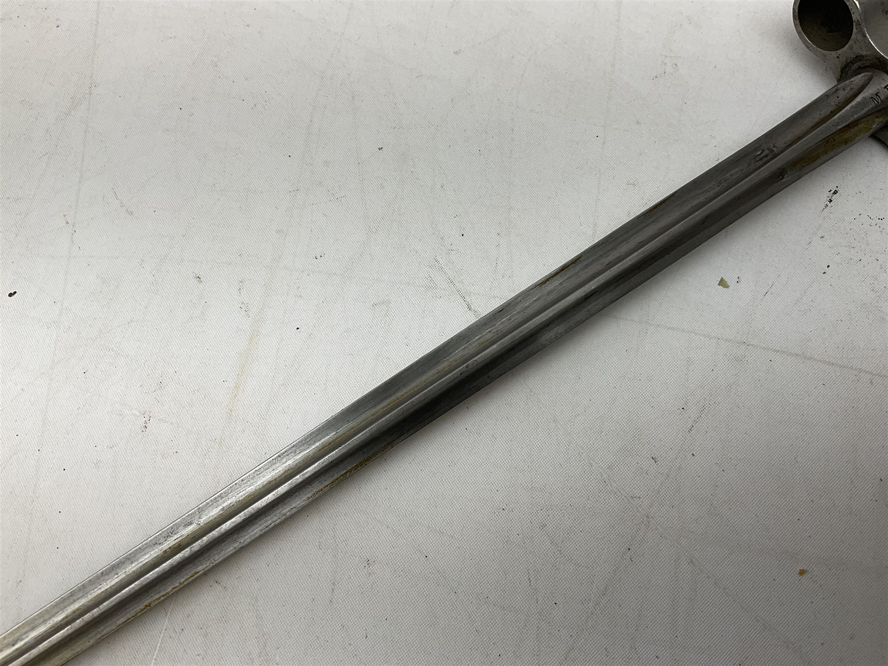 French Lebel Model 1886/93/16 bayonet with 52cm steel cruciform blade and brass hilt No.R22136; in steel tapering round scabbard numbered A62918 L65.5cm overall