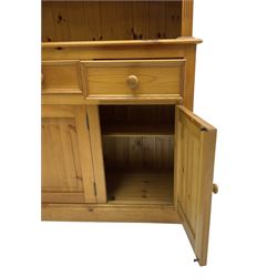 Traditional pine dresser, the rack fitted with two shelves flanked by glazed cupboards, the base with three drawers over three panelled cupboards