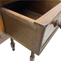 Medium oak side table, rectangular top over three drawers, on turned supports united by H-shaped stretcher rails 