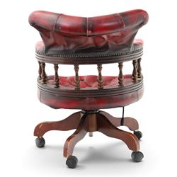 Georgian design captains swivel desk chair, rolled cresting rail over open spindle back on swivel action, upholstered in buttoned oxblood leather