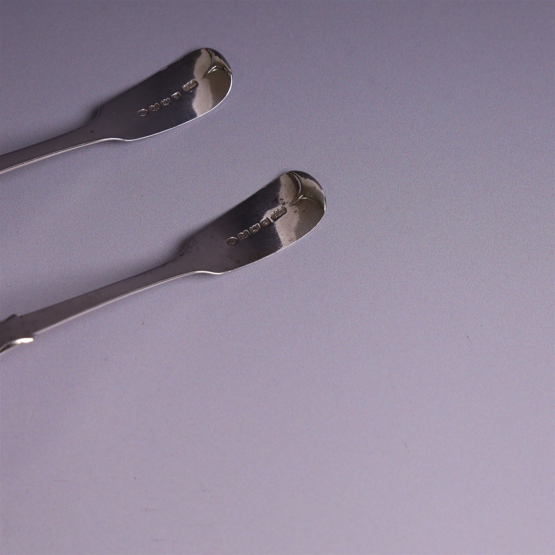 Pair of William IV silver Fiddle pattern spoons, comprising ladle and sifting spoon, each with presentation engravings to terminal, hallmarked William Rawlings Sobey, Exeter 1836