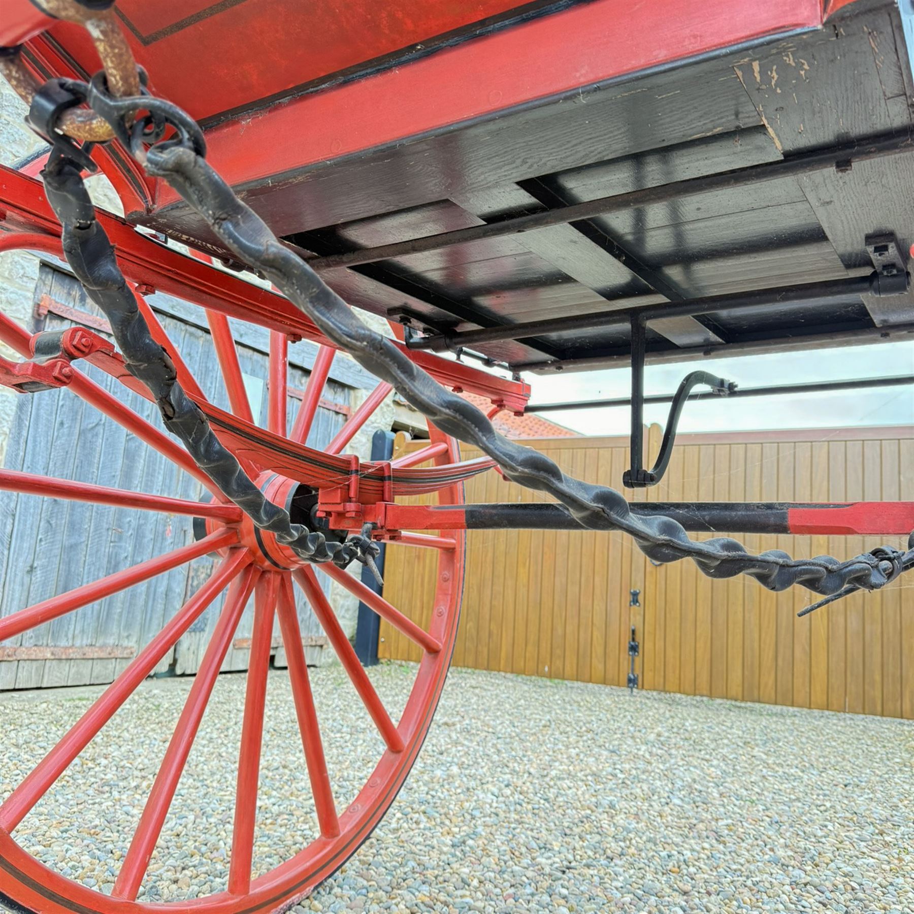 Holland & Holland Tandem Cart - Althorp Spencer Family Estate

A two wheeled tandem cart or cocking cart by Holland & Holland Coach Builders, London, with black painted bodywork, red painted shafts and running gear, red wooden spoked wheels with rubber tyres, green upholstered seating and a rear perforated metal footboard. The cart is fitted with carriage lamp brackets (lamps next lot), green buttoned cushions with leather retaining straps, side louvered body panels, footrests, leaf spring suspension and shafts for horse use. The carriage incorporates an adjustable body position, operated by a lever, allowing the body to be moved forwards or backwards to alter the weight distribution. Formerly owned by the family of Lady Diana Spencer,
Sympathetically conserved by Woods of Fairbourne Carriages Ltd, Kent.

Features:
• Brass maker’s plaque for Holland & Holland Coach Builders, London
• Two wheeled tandem cart
• Black painted body with red painted shafts and running gear
• Red wooden spoked wheels with rubber tyres
• Green upholstered cushions with leather retaining straps
• Adjustable carriage body for weight distribution
• Lever operated adjustment mechanism
• Perforated rear footboard
• Side footrests
• Louvered side panels
• Leaf spring suspension
• Rear opening storage compartment
• Decorative painted armorial motif to rear panel
• Fitted carriage lamps shown, not included in the lot (available as next lot)
• Conserved by Fairbourne Carriages Ltd
• Provenance: The Althorp Attic Sale including The Spencer Carriages, lot 195, 7 July 2010

Dimensions:
Overall length 396 / 198cm
Width 155cm
Height 190cm

Wheel Diameters:
Wheels: 148cm

Seating:
Driving seats: 2
Passenger seats: 2