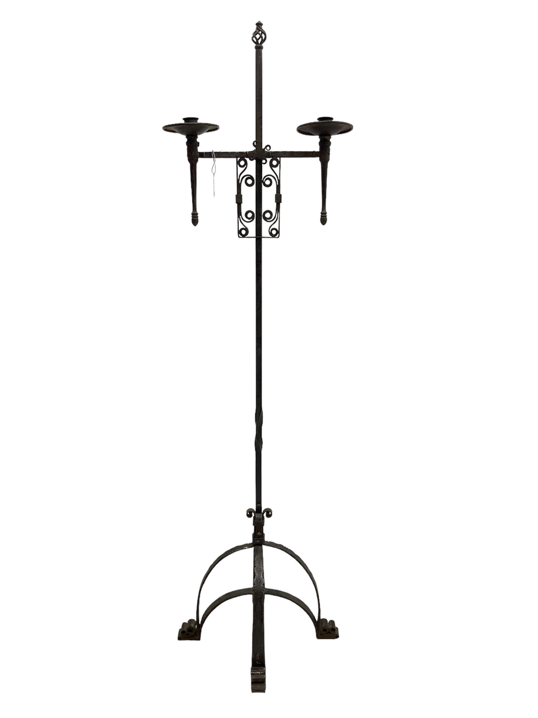 Ironwork candle holder stand, with stamped decoration, adjustable two branch sconces with scrolled iron work, twist stem with arched supports with scrolled terminals