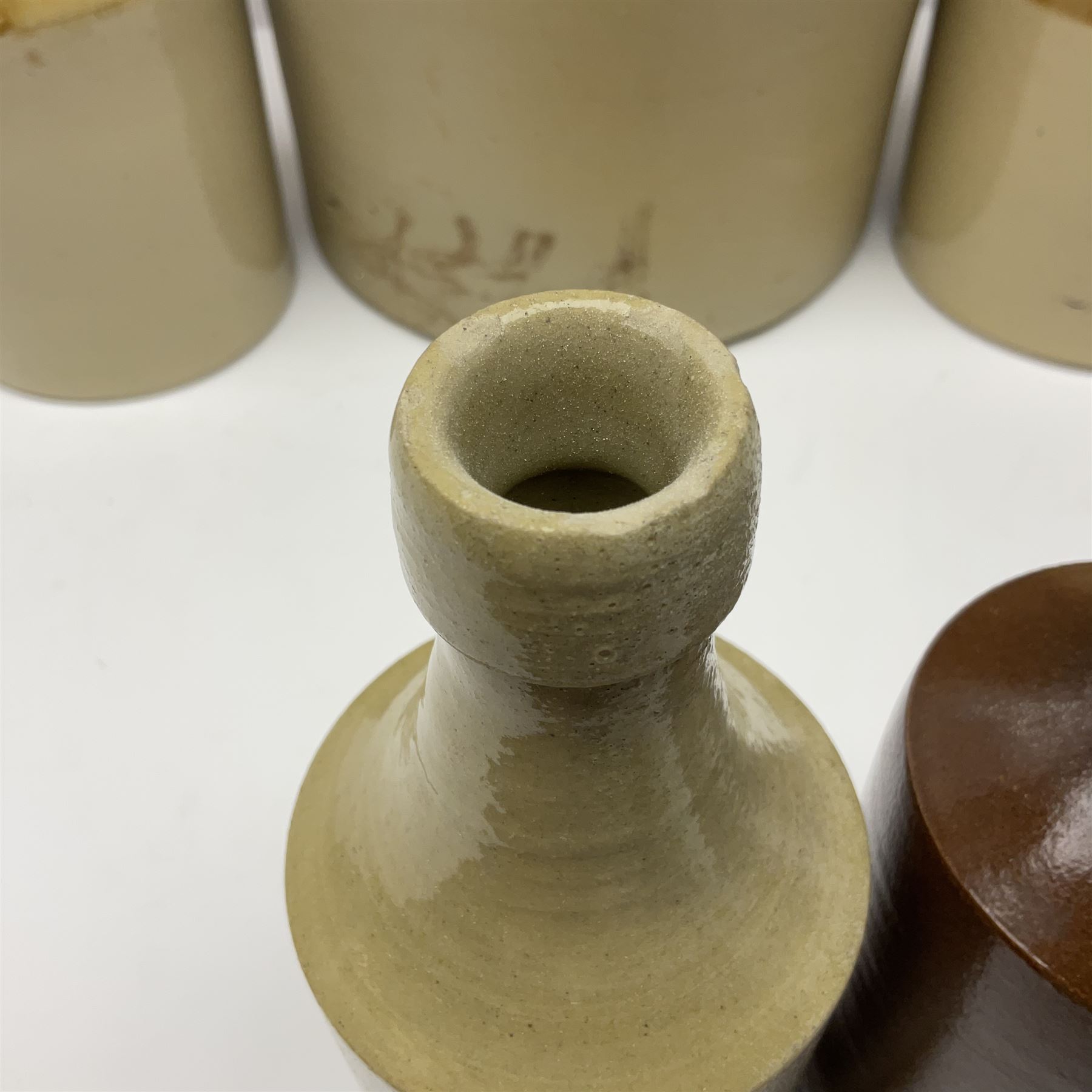 Large 2 gallon stoneware flagon, stamped 'John Soulby Wine Merchant Malton 2 Gall', together with a collection of similar stoneware jars and bottles, largest H40.5cm