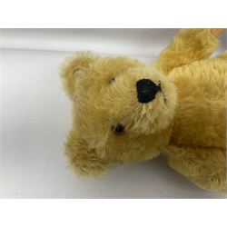 Steiff teddy bear with golden plush body, revolving head, applied eyes, vertically stitched nose and mouth and jointed limbs; button to left ear H26cm; and two other Steiff teddy bears, each with open mouth and button with tag to left ear (3)

