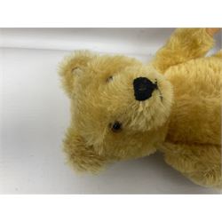 Steiff teddy bear with golden plush body, revolving head, applied eyes, vertically stitched nose and mouth and jointed limbs; button to left ear H26cm; and two other Steiff teddy bears, each with open mouth and button with tag to left ear (3)

