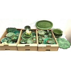 A large collection of various cabbage leaf wares, to include various bowls, dishes, plates, teapots, etc. (Qty). 