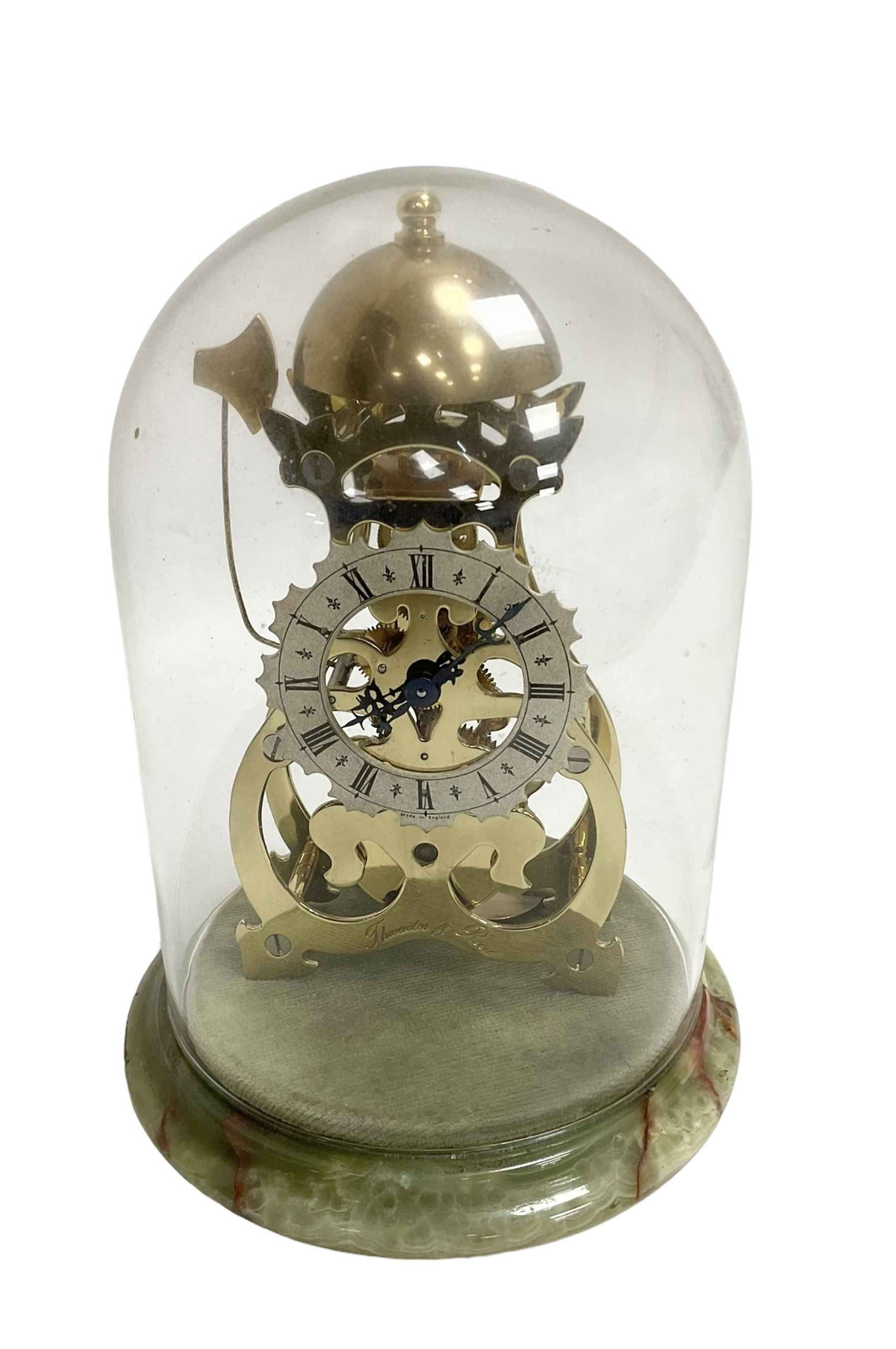 Thwaites & Reed - Small 20th century skeleton clock with a glass dome and stepped onyx base,  pierced movement frames with a silver chapter ring, Roman numerals, minute markers, and steel hands, domed brass bell with passing strike on the hour, with a lever platform escapement, wound and set from the rear. With key.