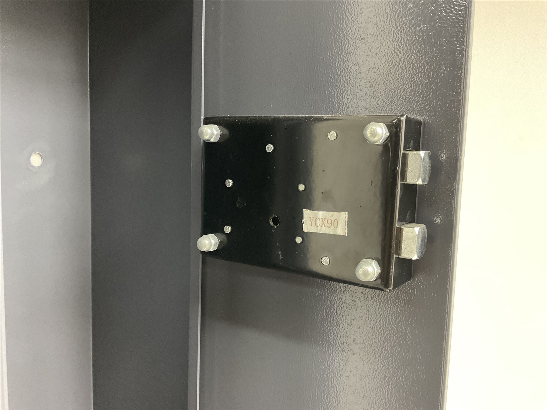 Grey steel wall mounting gun cabinet to accommodate three guns; single door with two locks with two keys for one lock; internally H128.5cm W21cm D17.5cm; externally H129cm W21.5cm D20cm