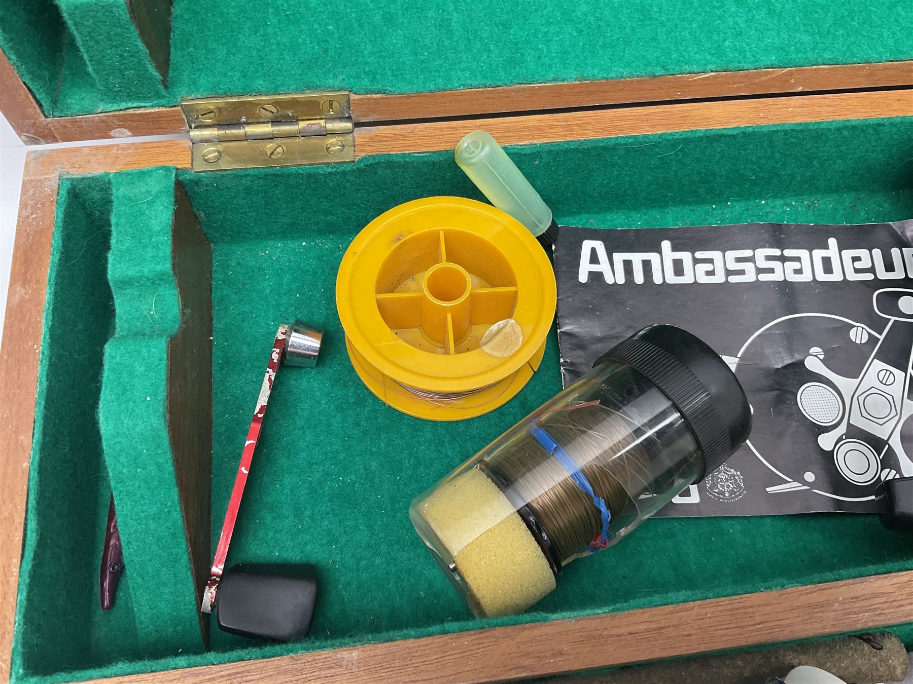 Four Abu fishing reels, comprising Ambassadeur 9000, Ambassadeur 7000, Ambassadeur 5500 and Ambassadeur 6500, together with additional line, hardy fishing bag and two wooden boxes