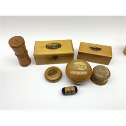 A group of 19th century Mauchline ware, to include two stirrup cup holders, one containing glass, one example featuring St Brycedale Free Church Kirkcaldy, three rectangular boxes, the largest featuring Main St Largs, etc., plus a 19th century treen dice shaker. 