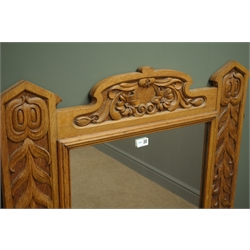  Edwardian oak framed wall mirror, with shaped cresting, carved with foliage, W84cm, H118cm, D5cm  