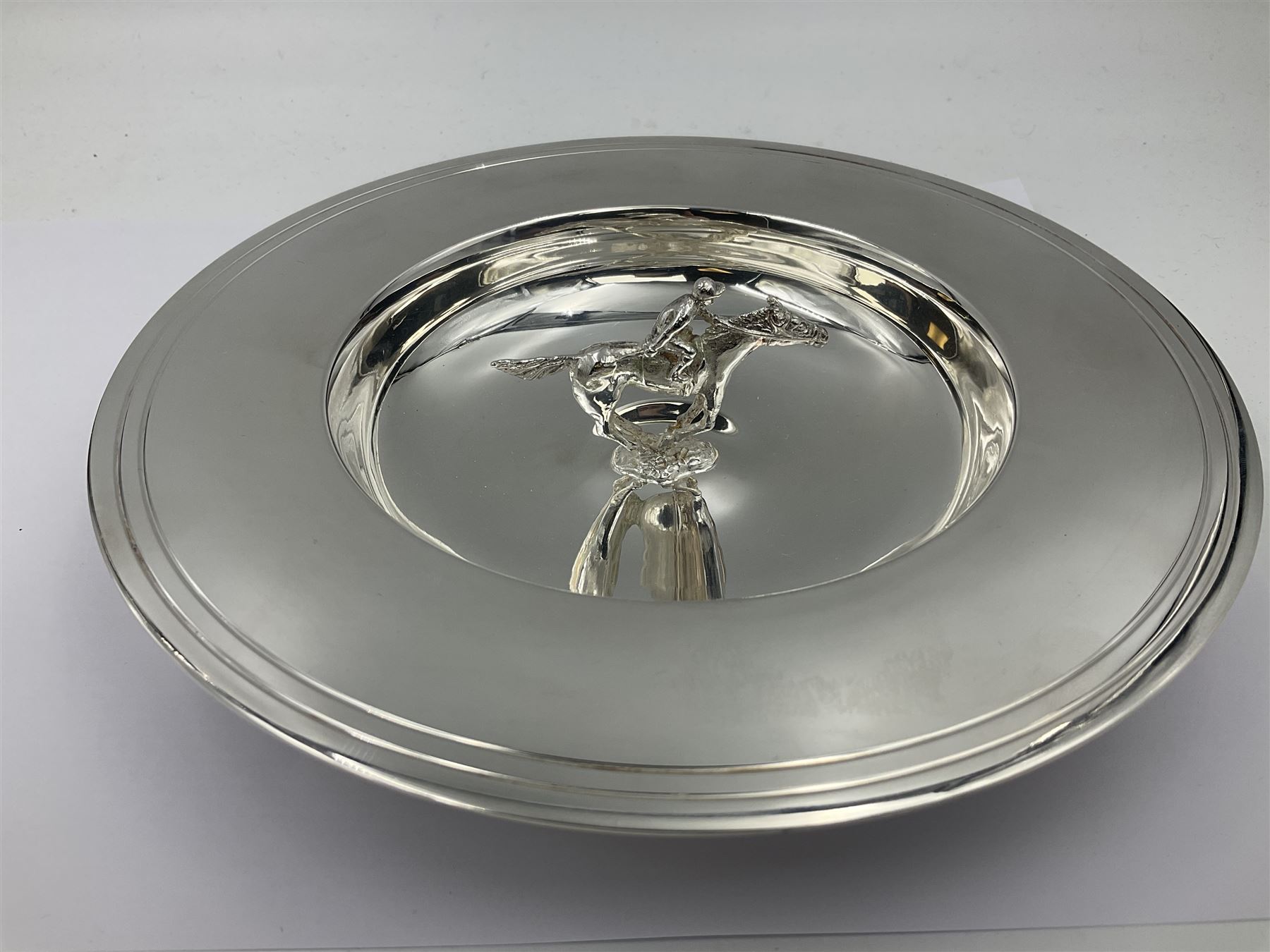 Spanish silver coin dish, with white metal chain rim and upon three ball feet, together with a silver plated armada style dish, with cast racehorse and jockey to centre, coin dish D4.8cm, armada dish D20.5cm