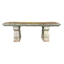 Weathered cast stone three piece bench, the rectangular seat with moulded edge, raised on Neoclassical style end supports with S-scrolls and fruiting grapevines, on rectangular bases