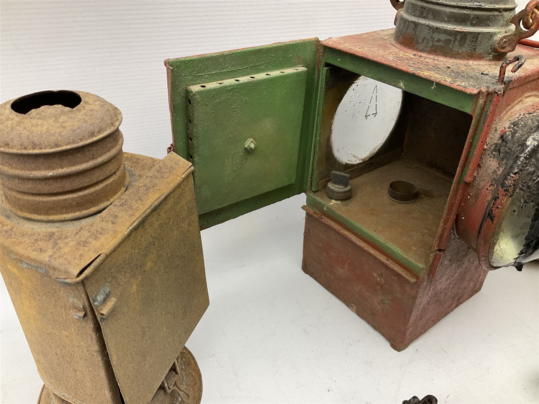 Collection of cast iron lamps, predominantly railway and coach examples, to include John Phillips Light of London Lamp Co coach lamp and Lito bicycle lamp by Miller & Co of Birmingham, etc