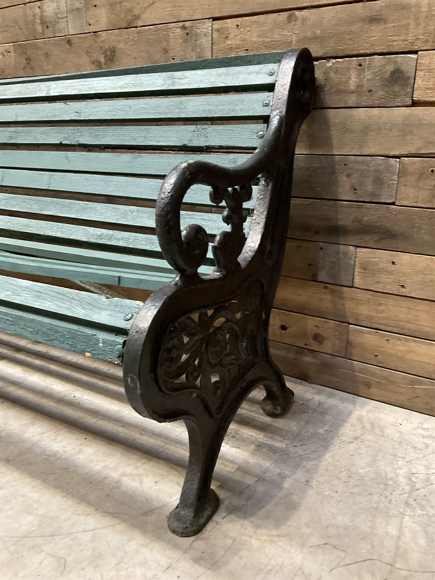 Early 20th century slatted garden bench with scrolling cast iron bench ends