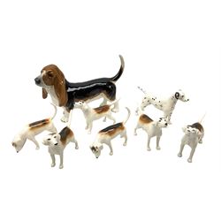 Collection of Beswick figures modelled as dogs comprising Basset Hound model no. 2045, Arnoldene Dalmatian no. 961, together with six hounds in varying poses