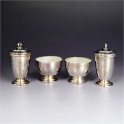 Art Deco silver five piece cruet set, comprising mustard pot, two pepper shakers and two open salts, hallmarked Hukin & Heath Ltd, Birmingham 1937, together with two silver salt spoons, hallmarked, mustard pot and salts with frosted glass liners, all contained within fitted tooled leather case