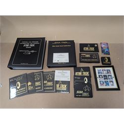 Star Trek collectables, including Danbury Mint '22ct Gold Card Collection', PCS Stamps and Coins Official US Postage Celebrating The Original Star Trek Series, Star Trek St Vincent and Grenadines first day cover collection, four stamp sets and a framed set of similar stamps, commemorative coins, Star Trek The Experience Las Vegas coin, three commemorative 'gold stamps' and three albums of collectors cards and telephone cards