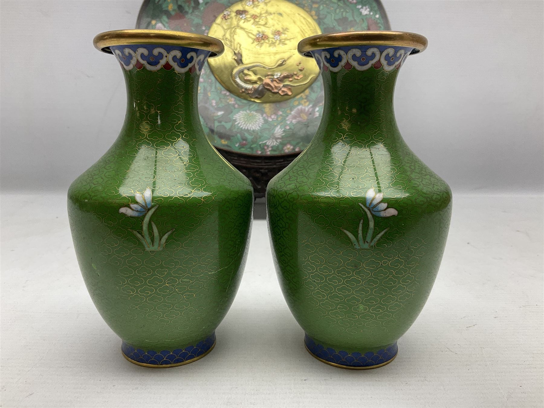 Cloisonné plate decorated with birds and flowers, together with a pair of Cloisonné vases of baluster form 