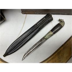 Assorted militaria including ten leather or canvas cartridge and other belts, maroon beret with 17th Lancers cap badge, modern bullet mould, leather and brass shot flask, two knives, shell cases, boomerang etc; in tin deed box