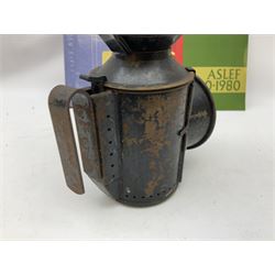 Black painted three colour railway lamp with revolving filters, H29cm; BR Acme Thunderer whistle; three railway peaked caps, two with BR Intercity 125 badge; small album of photographs of railway interest etc