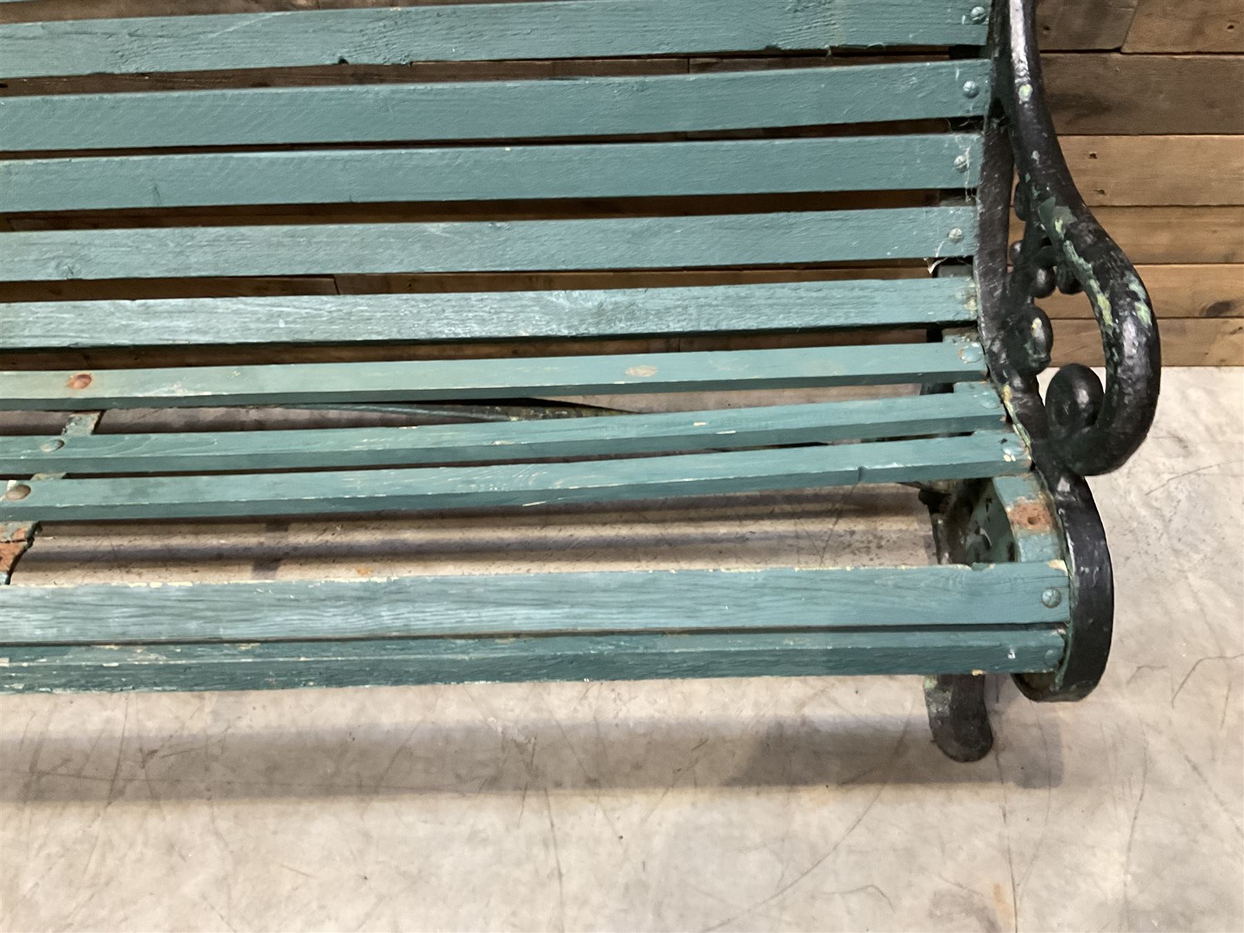 Early 20th century slatted garden bench with scrolling cast iron bench ends