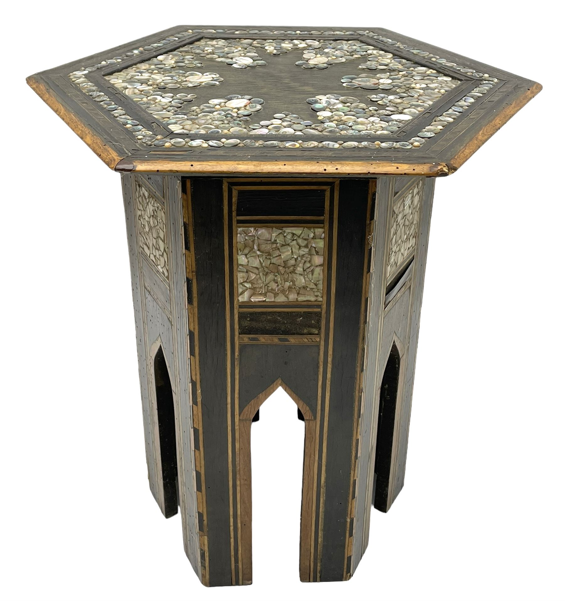 Early 20th century Anglo-Indian hexagonal table, the top decorated with mother of pearl beads and chequered banding, the base with fretwork pointed arches and inlays