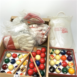 A boxed set of snooker balls, two boxed sets of pool balls, and quantity of unused cricket gloves and pads. 