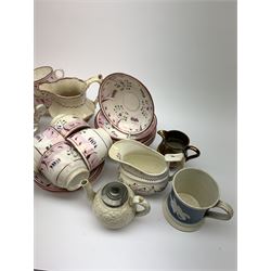 A group of pink lustre teawares, comprising nine tea cups, eleven saucers, jug, and boat, together with a small Gaudy Welsh coffee can, small coper lustre jug, 19th century mug with blue band and applied rose decoration, small 19th century relief moulded teapot with hinged pewter cover, and two 18th century Willow pattern tea cups. 